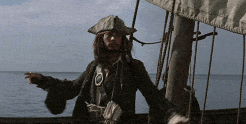 Captain Jack Sparrow on a ship overlooking the ocean.